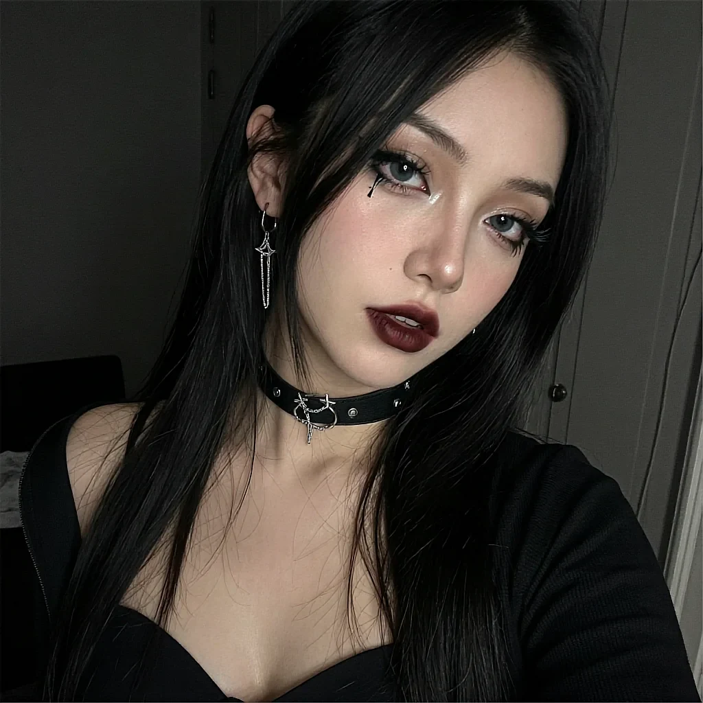 Fictional AI character with dark lipstick and a choker in a dimly lit room